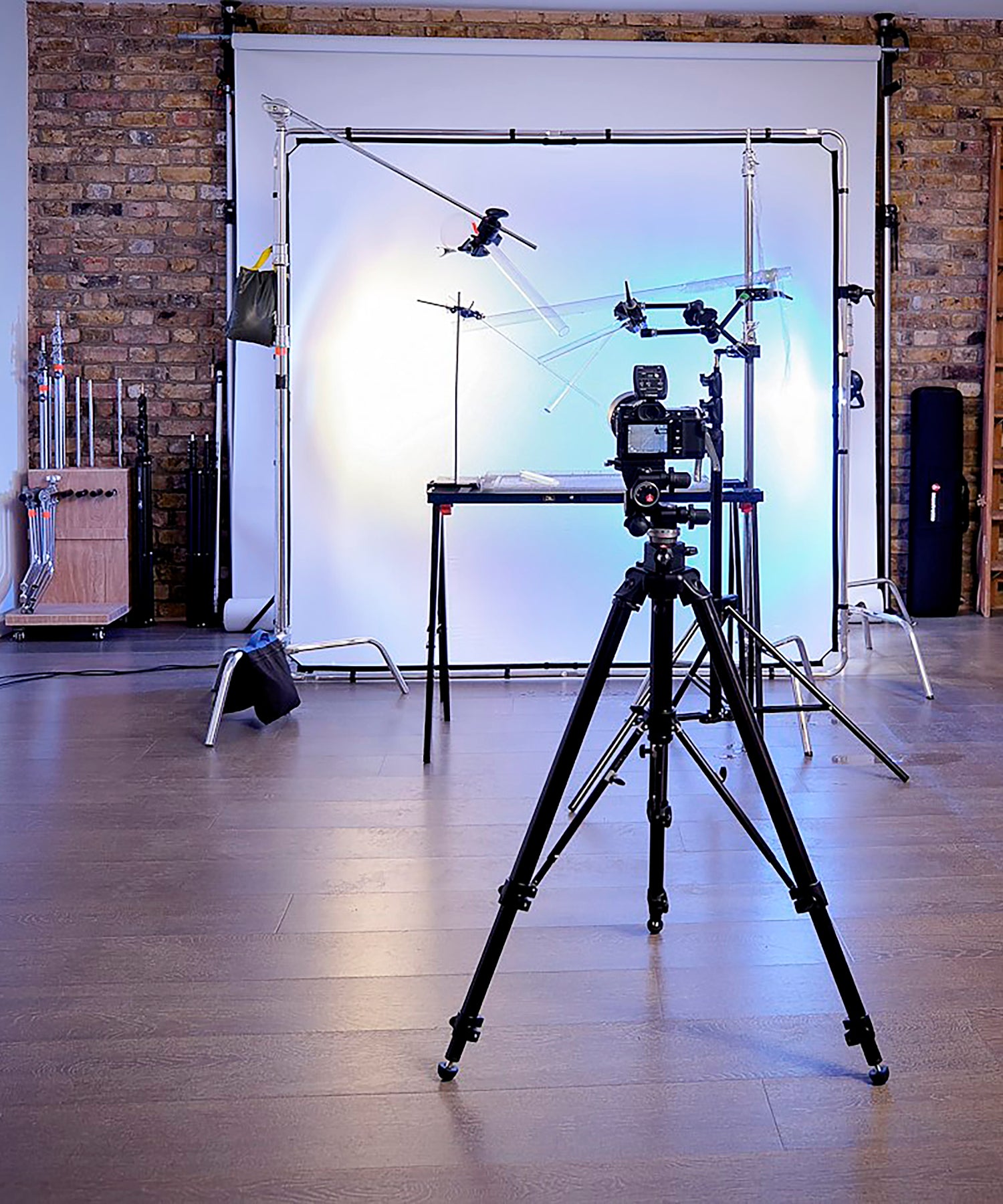 A typical professional studio envioment with wooden floor and Manfrotto Ezy frames in the background.