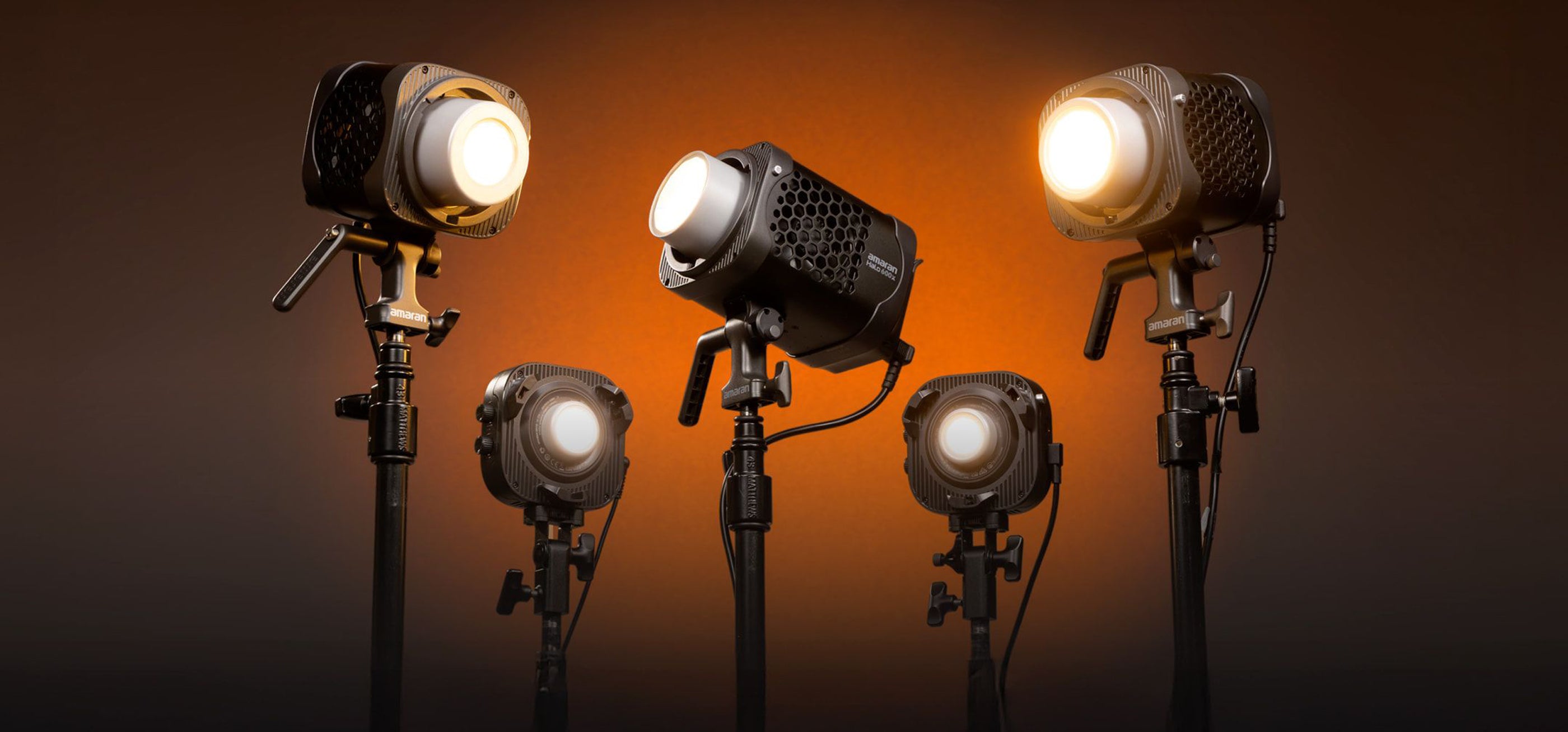 Five Amaran Halo fixtures on a orange graduated background, 60, 100, 200, 300 and 600Halo lights.