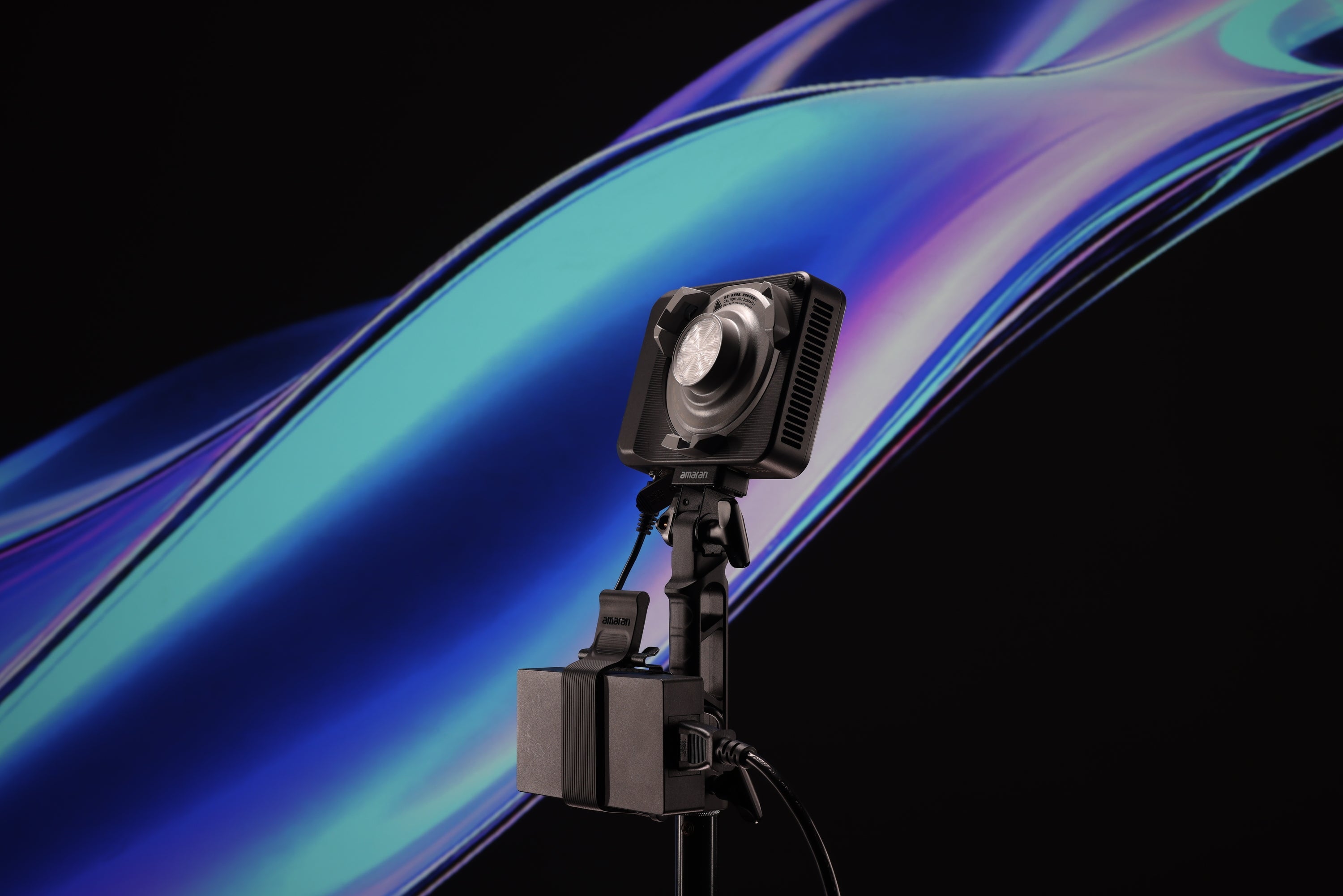 amaran Ace Lock to Baby Pin Adapter Grip with vibrant colours in the background.