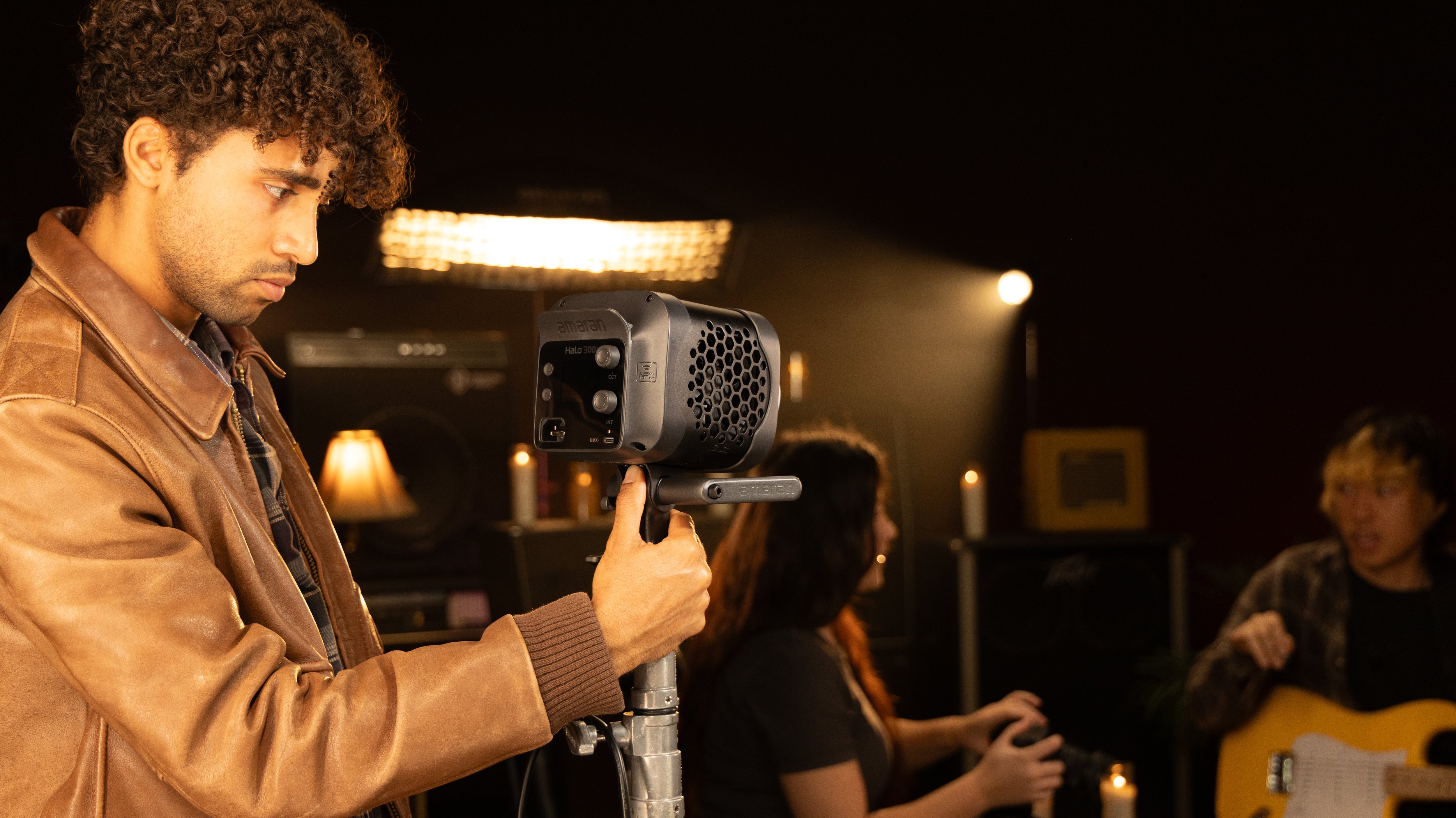 amaran Halo 300x lifestyle image with a lighting operator.