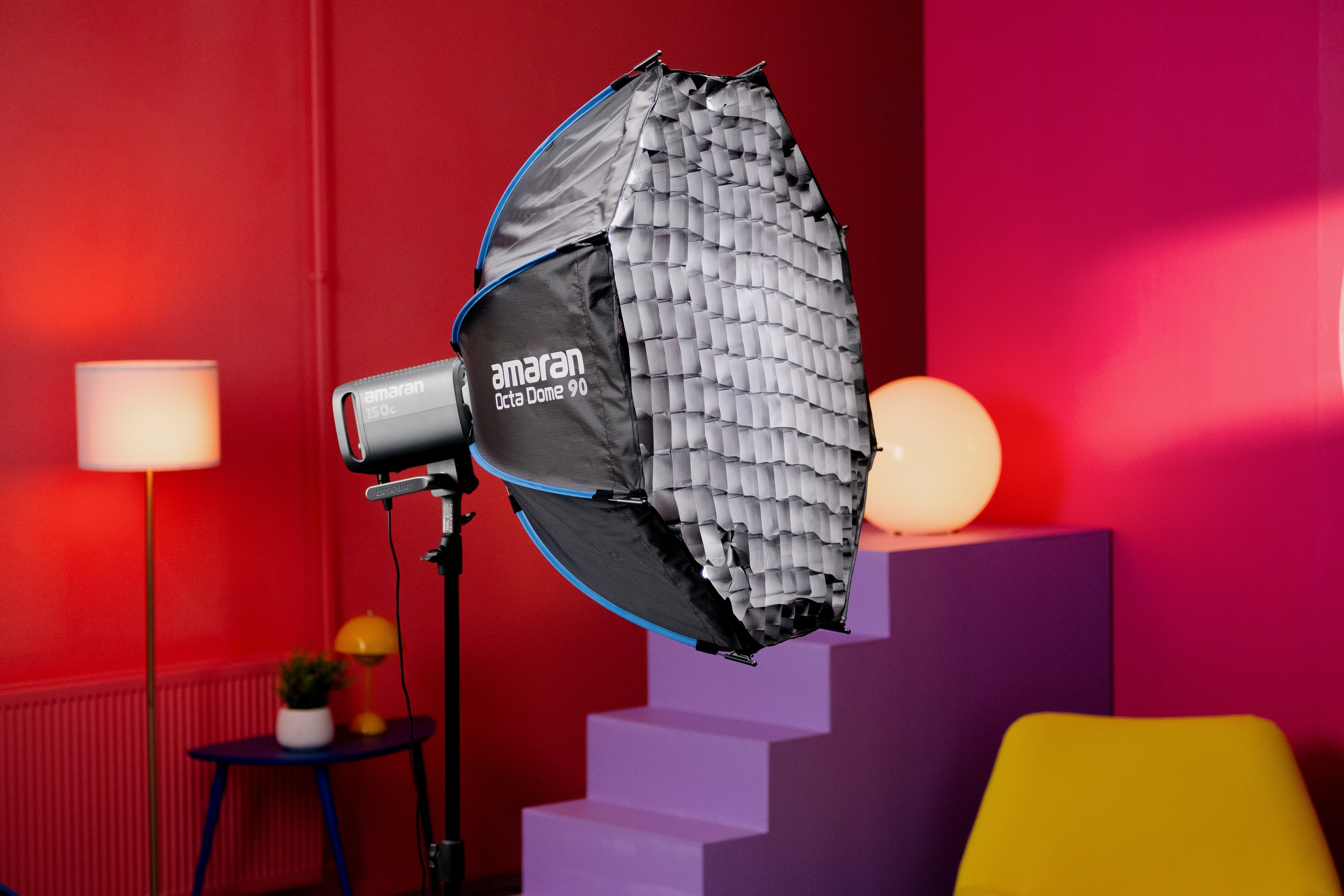 amaran Octa Dome 90 being used with a 150c light on a colourful background.