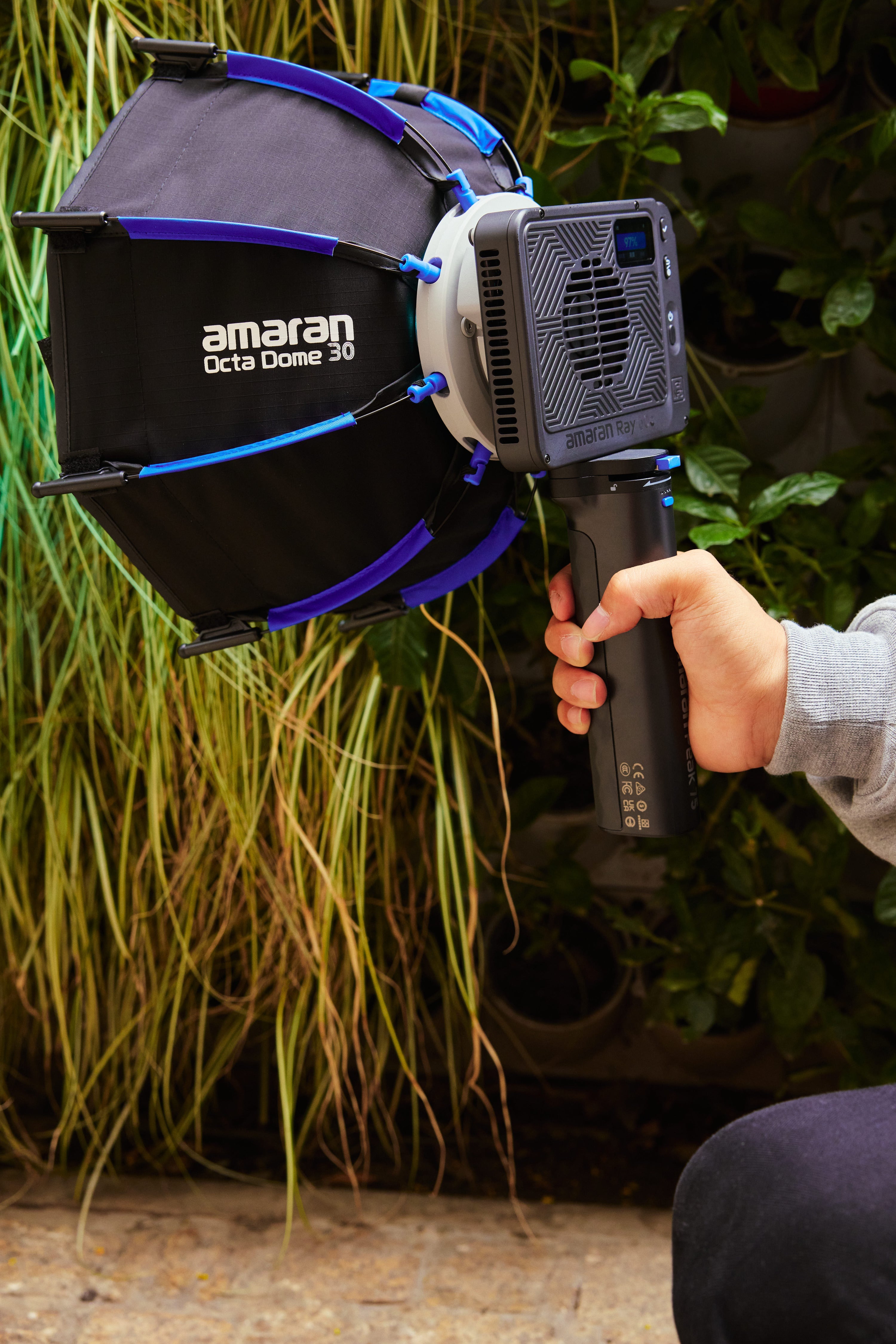 amaran Peak 75 Portable Battery Grip being used with a Ray light and Octa Dome.