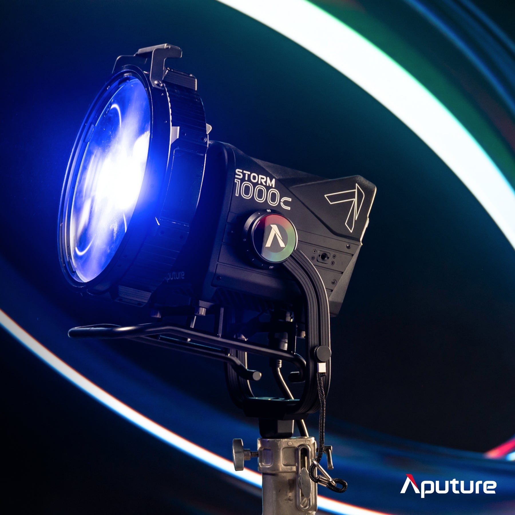 Aputre Storm 1000c with CF12 Fresnel and Skid Plate on coloured background.