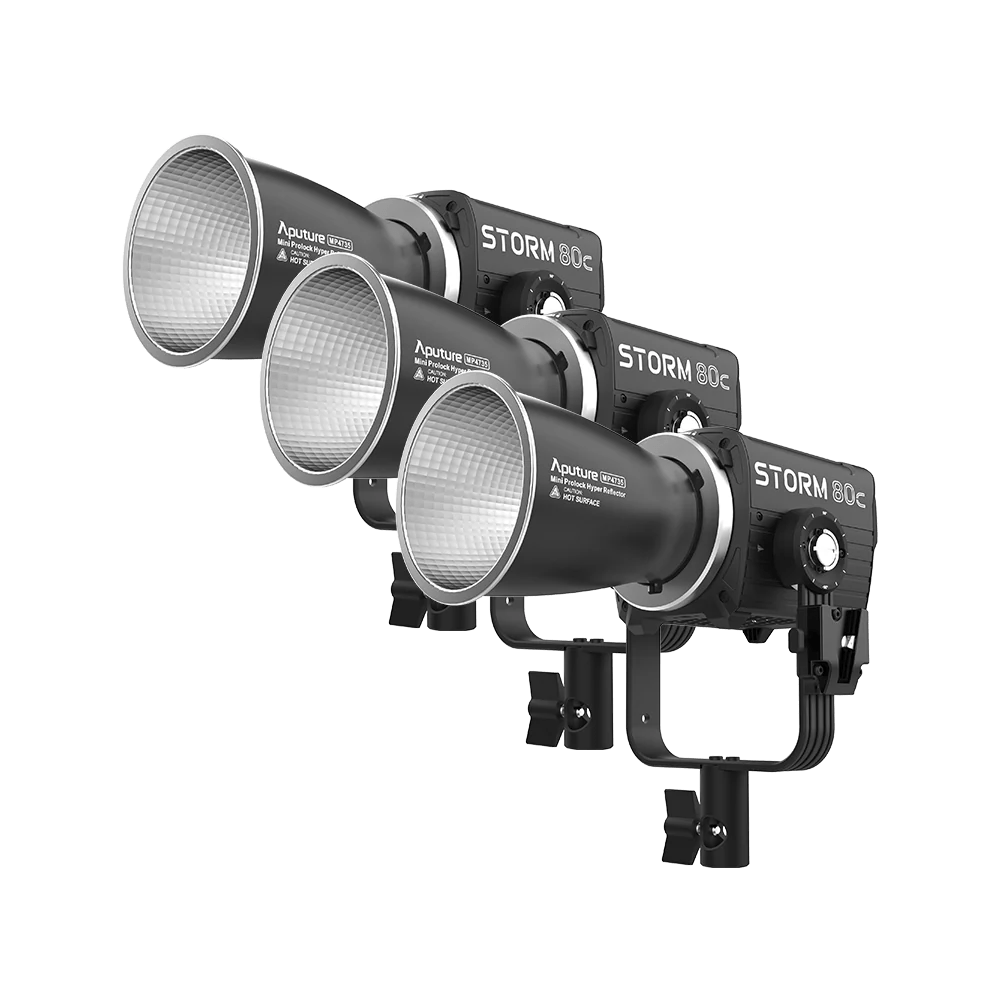 Three Aputure Storm 80c lights on a white background.