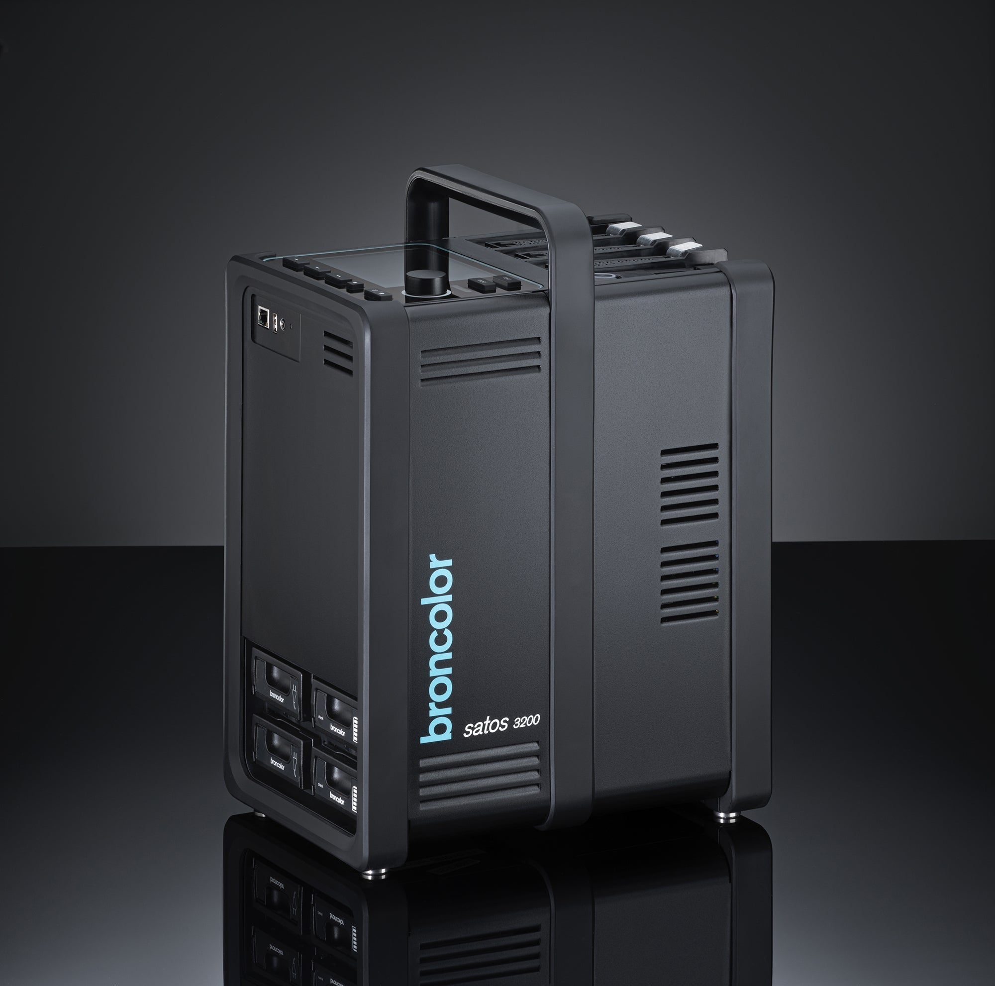 A black Empty Broncolor Satos 3200J lighting power pack, featuring a handle and several control buttons.