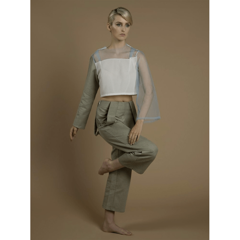 Model being photographed on a Colorama Cappuccino seamless studio background paper.