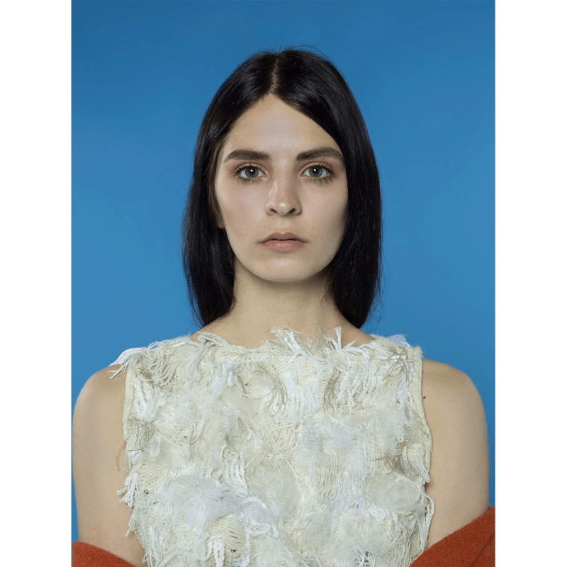 Portrait Shot with a model utilising the Colorama China Blue Seamless Background Paper.