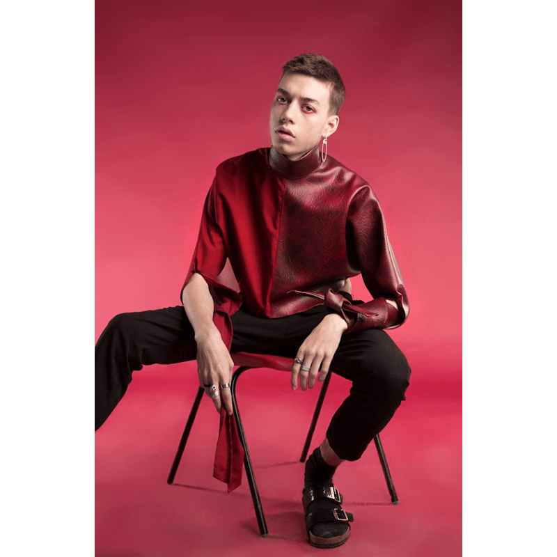 Male model being photographed with a Colorama Crimson Seamless Background.