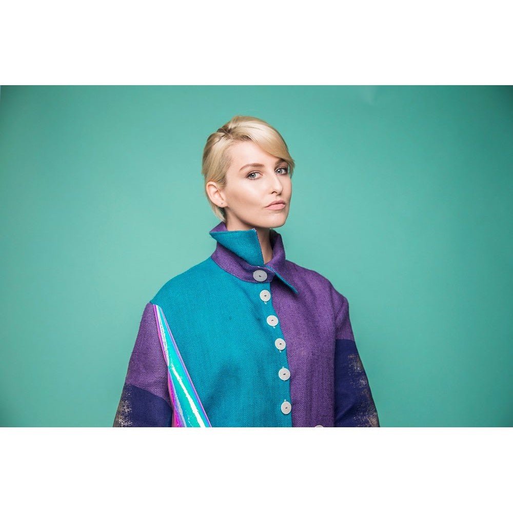 Landscape perspective of the Larkspur Colorama roll with a female model.