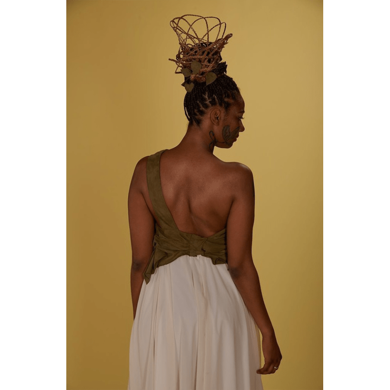 Portrait of a female model on shoot being photographed with a Lemon Seamless Background.