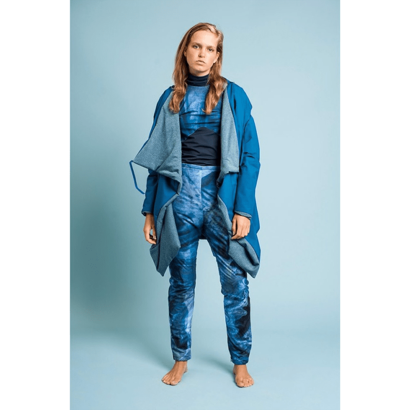 Model being photographed using a Lobelia Colorama roll of background paper.