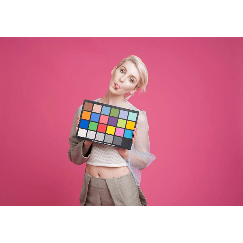 Female model being photographed with a Rose Pink background.