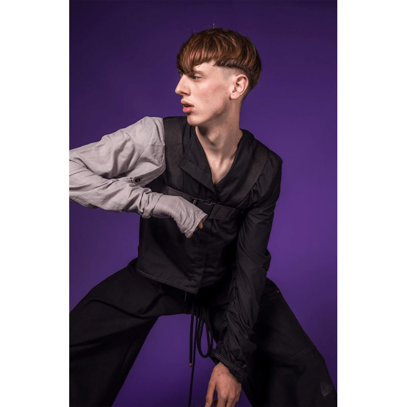 A Male Model pictured with a Royal Purple Colorama Background.