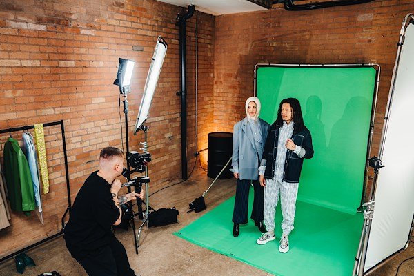 A studio setup with two models being captured utilising the Manfrotto 2x2.3m Ezy Frame.