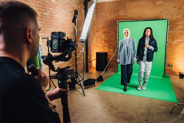 A studio setup with the Manfrotto Ezy Frame being secured by two sandbags.