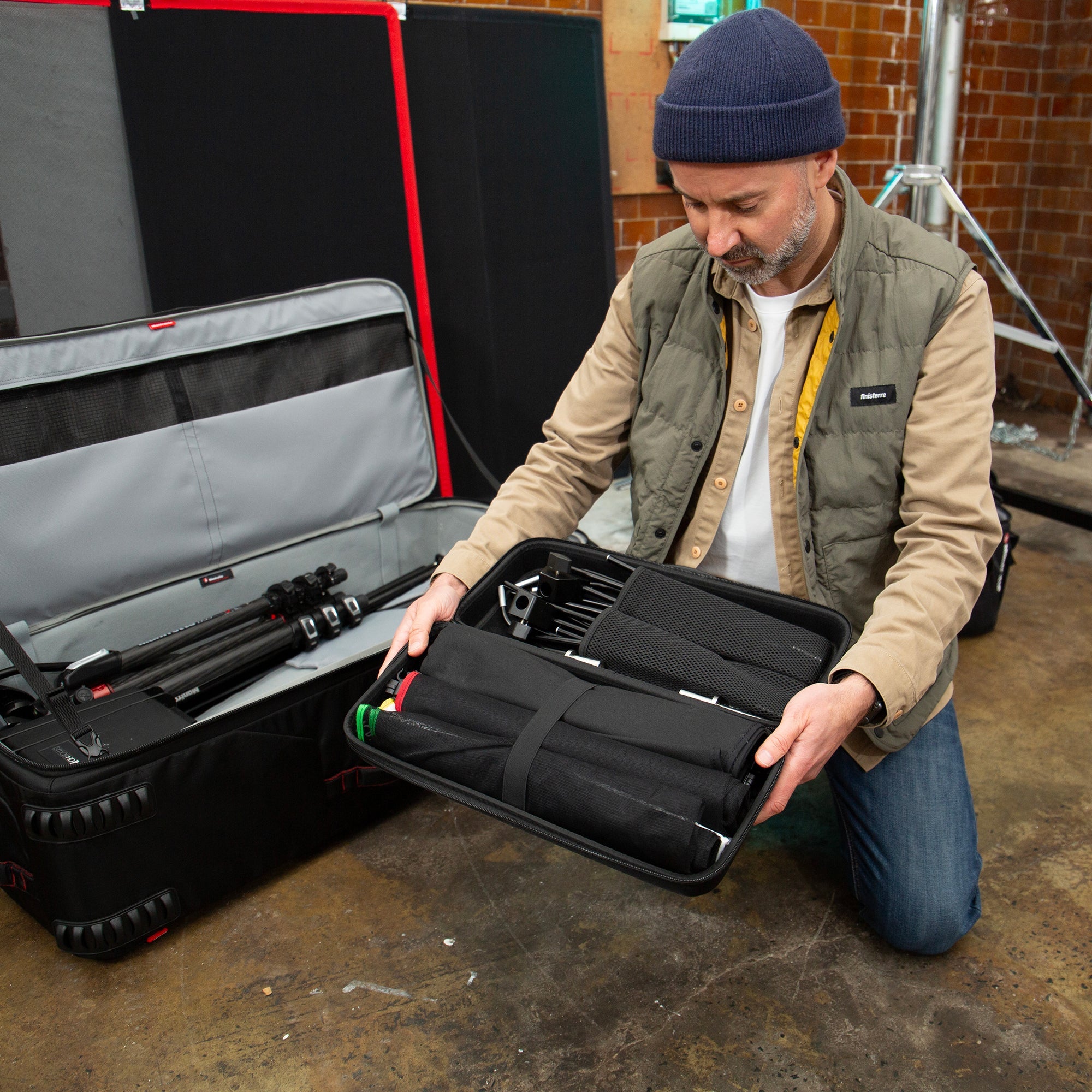 Manfrotto Rapid Flag 24"x36" kit shown open with a lightning technician holding the open kit.