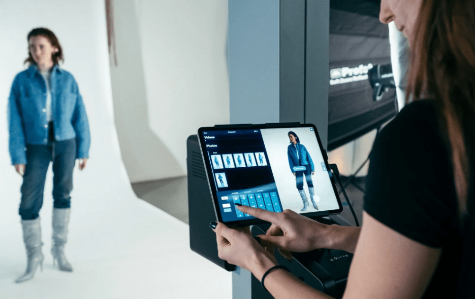 The Profoto Elevate being utilused with a model and a woman adjusting using the included iPad.