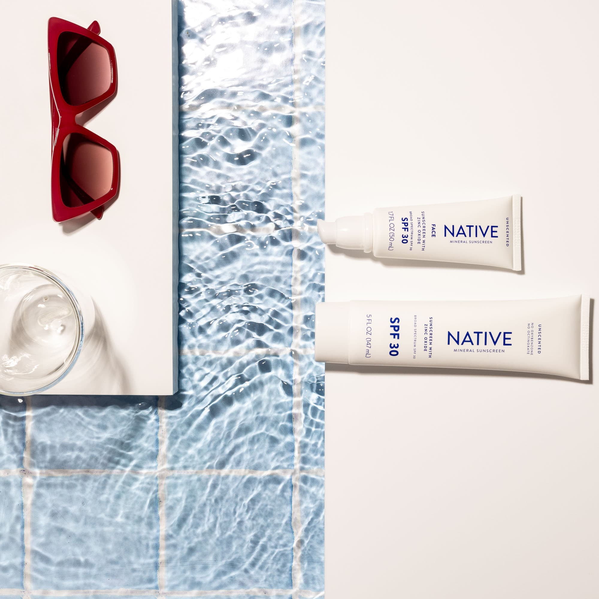 Final image incorporating water annd sunglasses into a suncream shoot.