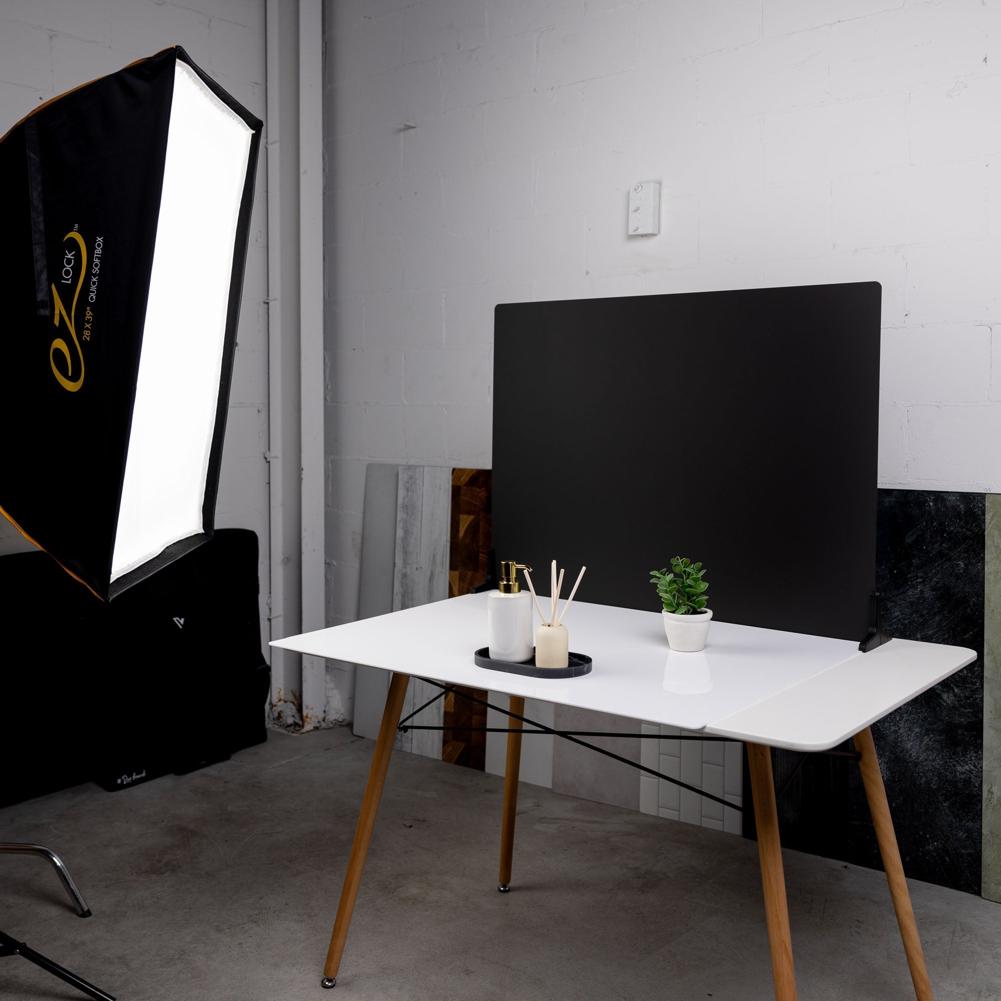 A studio environment using the V-Flat Black Gloss/Black Matte - XL Duo Board.