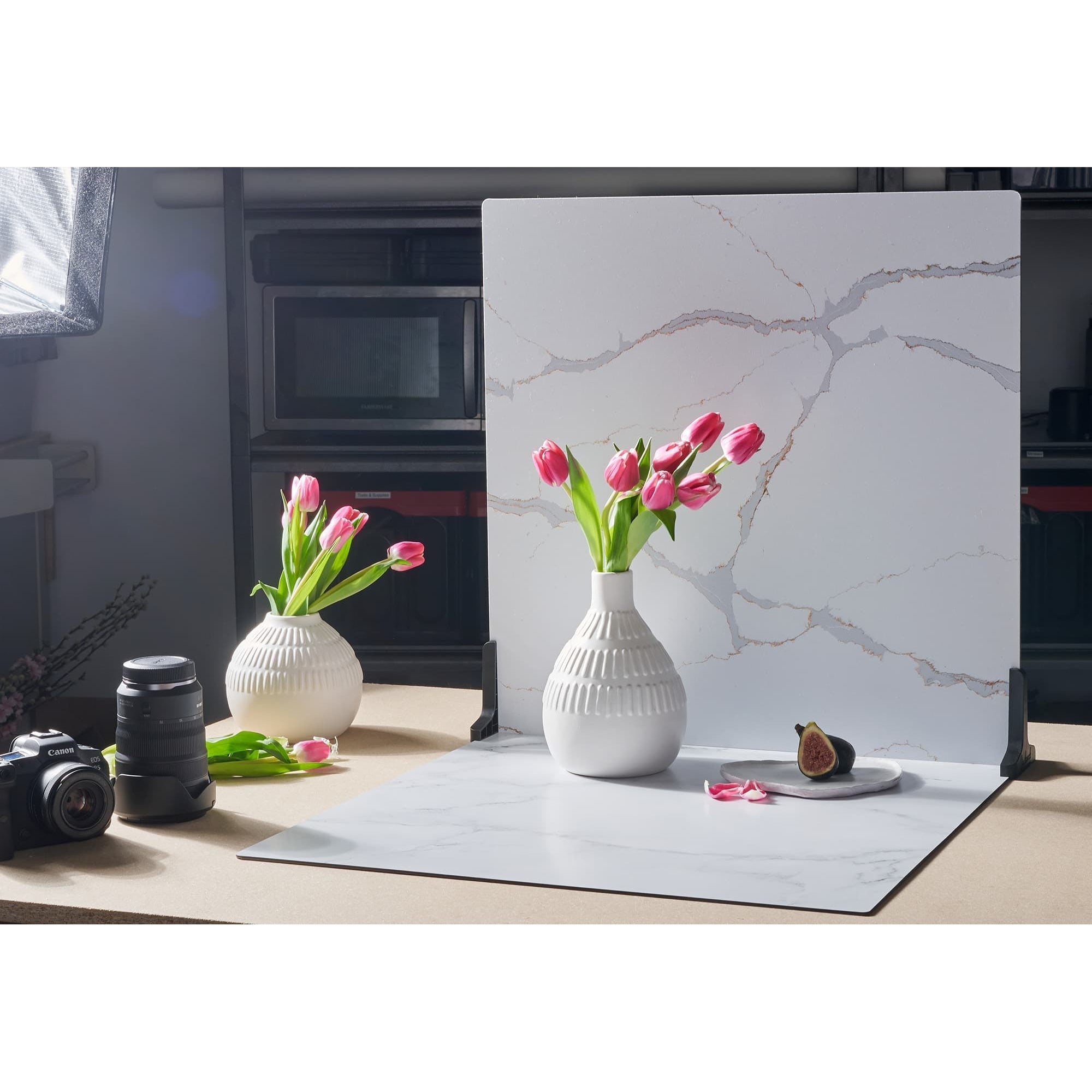 V-Flat Carrara Blue/Calacatta Gold Duo Board on a kitchen tabletop forming a studio setup.