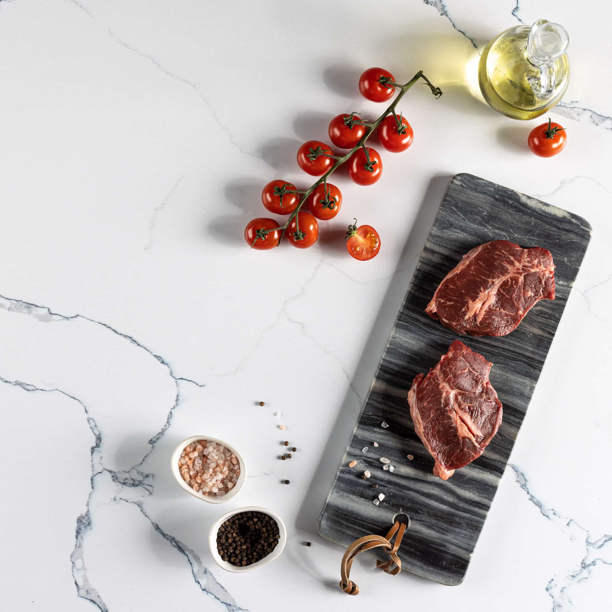 V-Flat Carrara Blue/Calacatta Gold Duo Board with some ingredients being pictured.