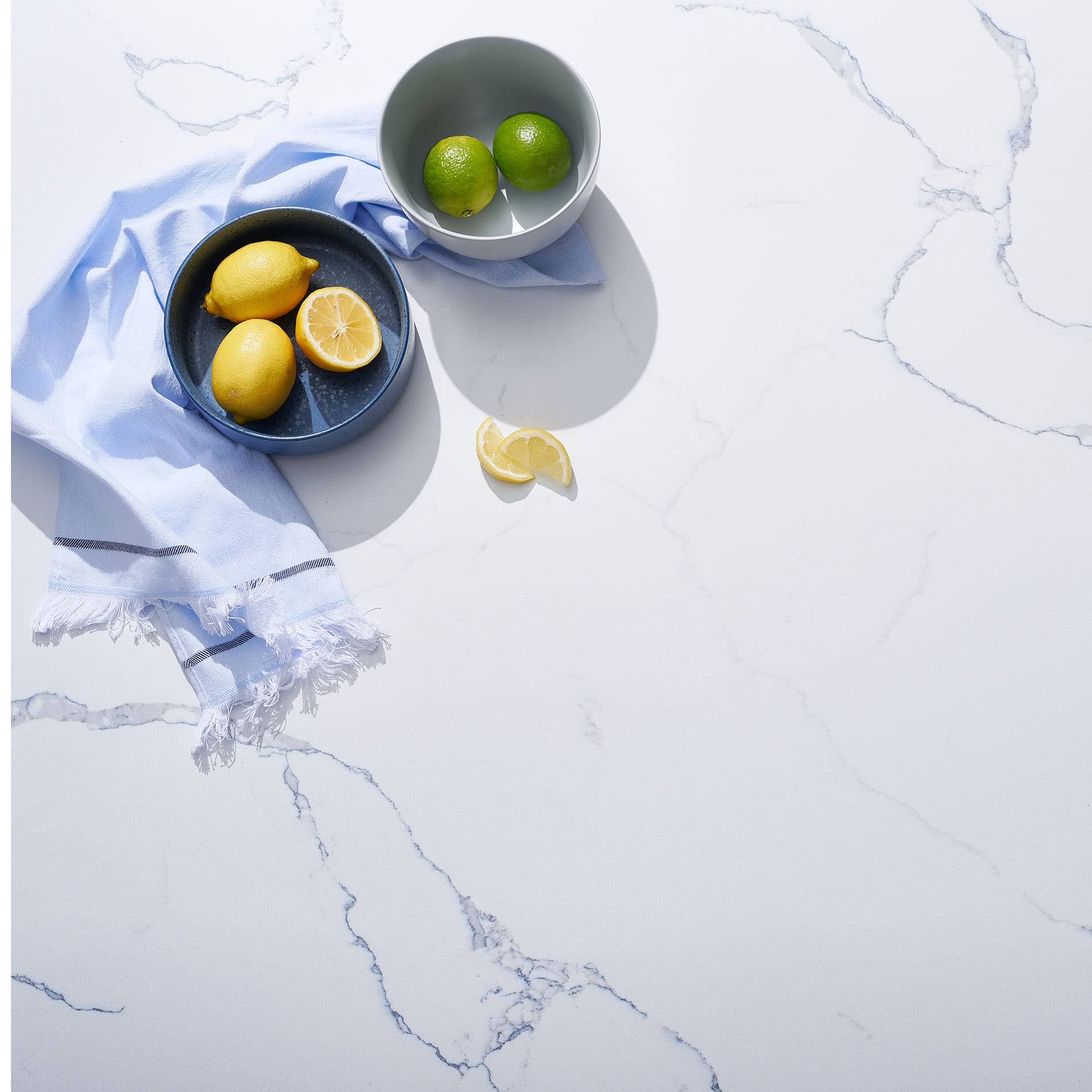 V-Flat Carrara Blue/Calacatta Gold Duo Board with fruit being showcased.
