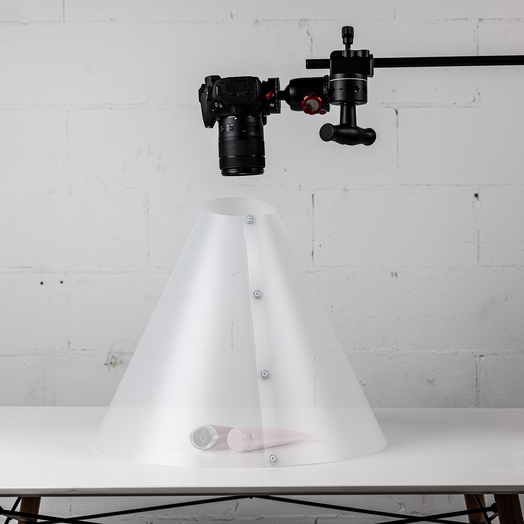 A photoshoot being conducted using the V-Flat Light Cone - Kit.