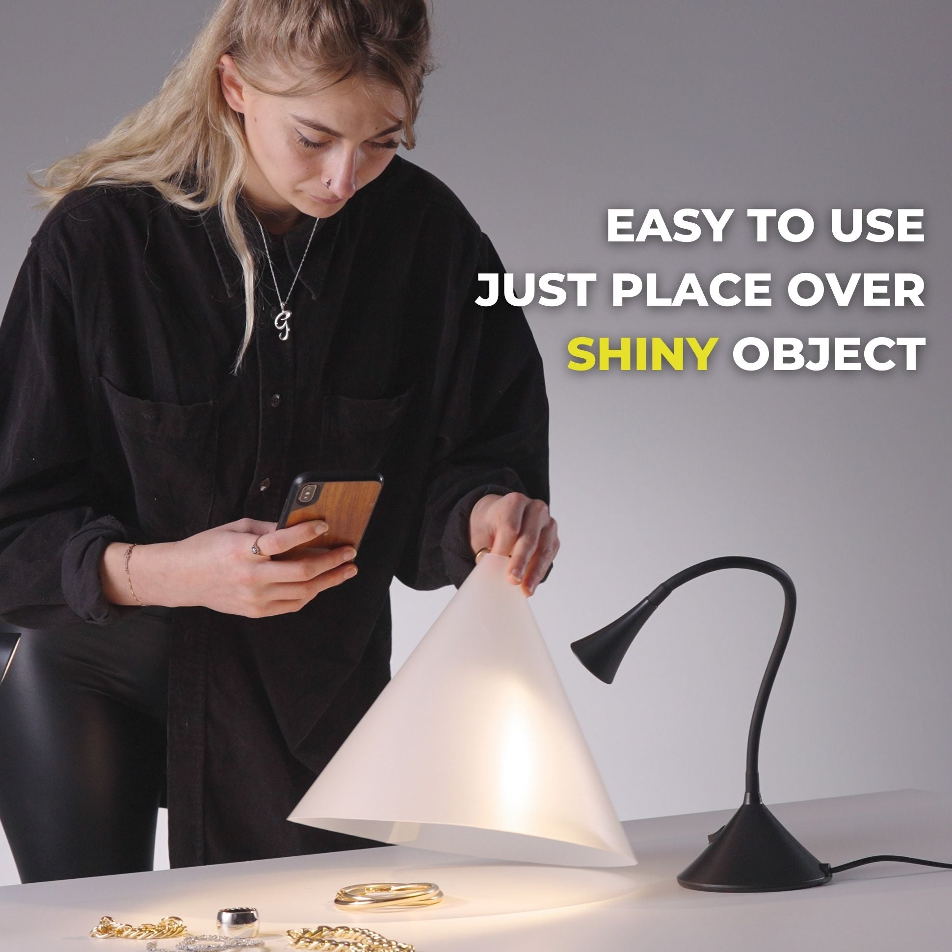 Person using the V-Flat Light Cone - Phone to photograph some jewellery.