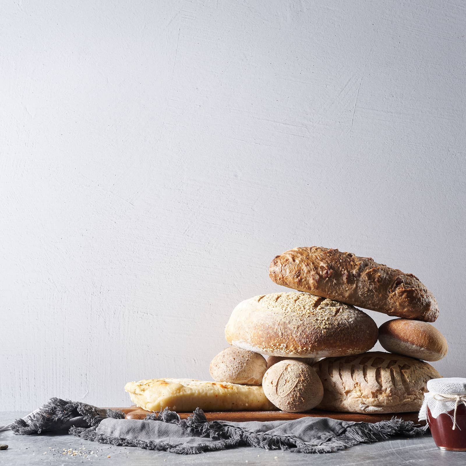 V-Flat Raw Concrete/Vintage Plaster Duo Board being used as a background for a photoshoot with bread.