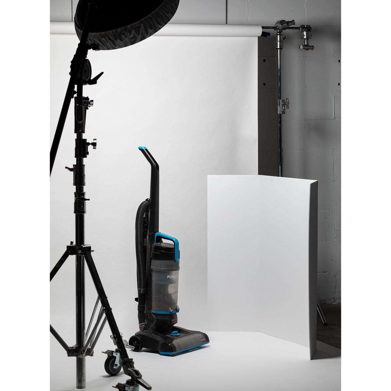 V-Flat Tabletop V-Flats - Large (3’X4') 2x white 2x Black shown with a hoover as a subject in a studio.