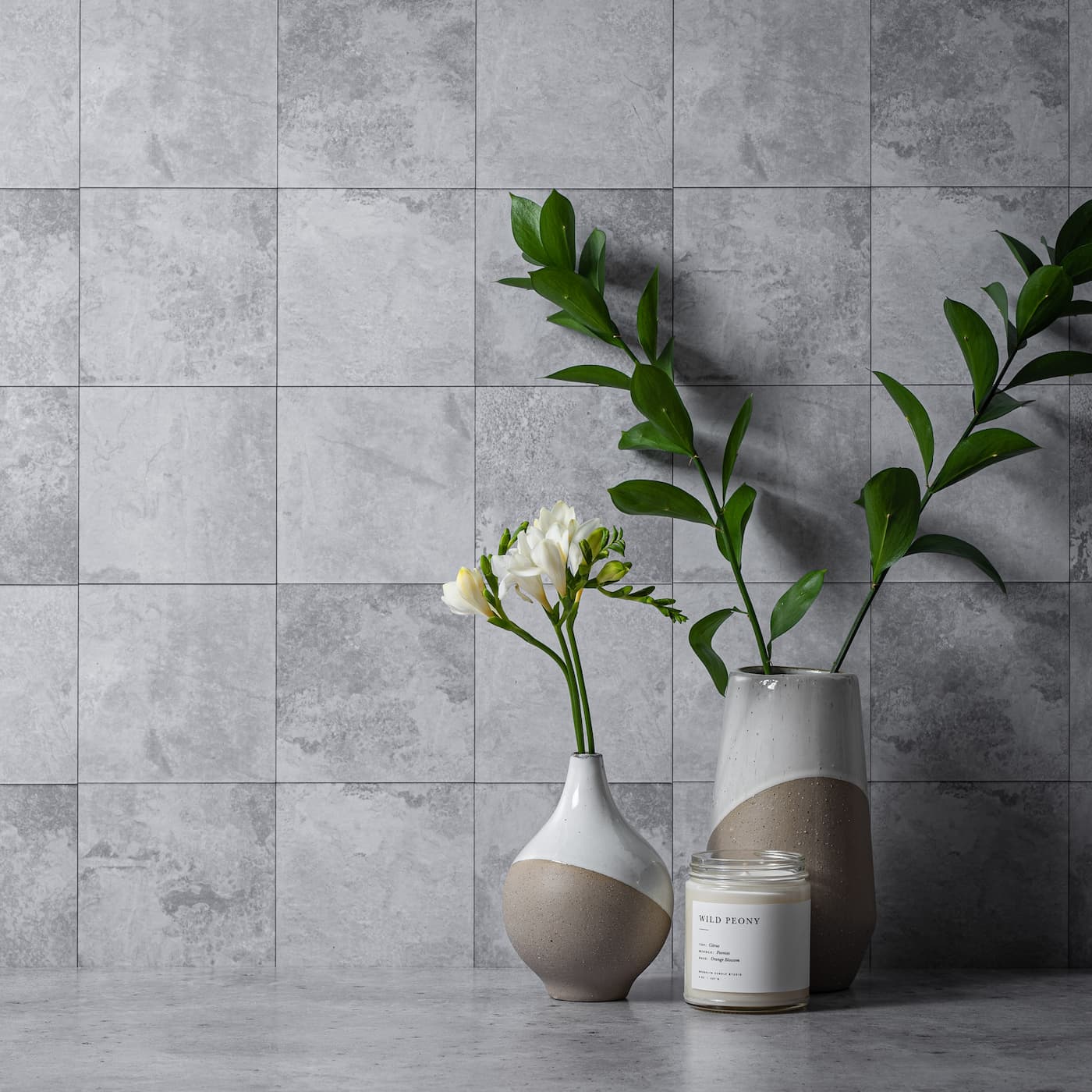 Final image utilising the V-Flat Wisp / Pebble Duo Board with some plants and a candle being photographed.