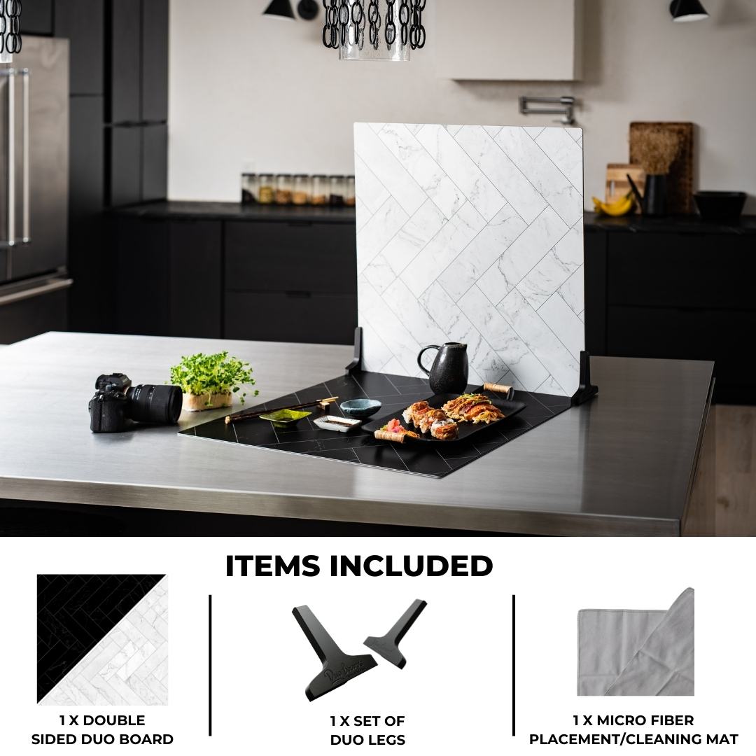 V-Flat Zigzag Marble White/Zigzag Marble Black Duo Board shown on a kitchen tabletop.