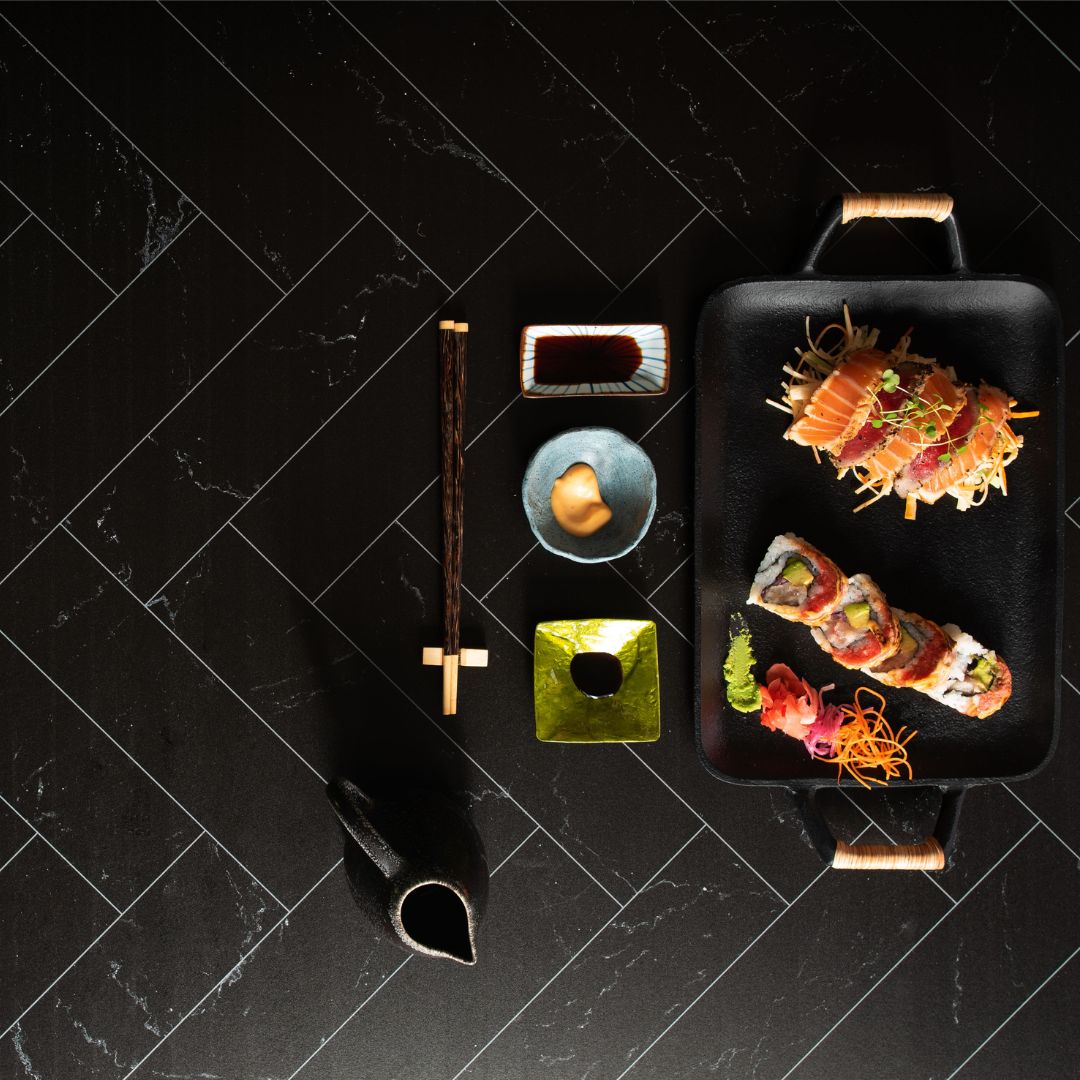 Birds eye view of sushi platter, showing the V-Flat Zigzag Marble White/Black Duo Board.