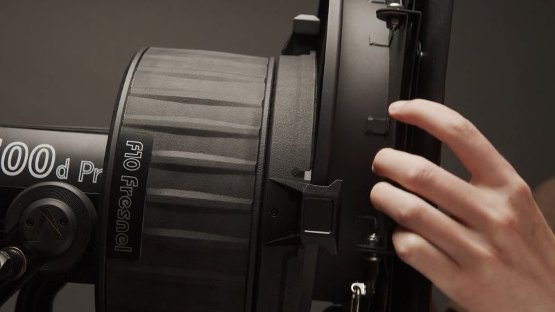 Side Angle of Aputure F10 Glass Fresnel connecting to Aputure 600d Pro.