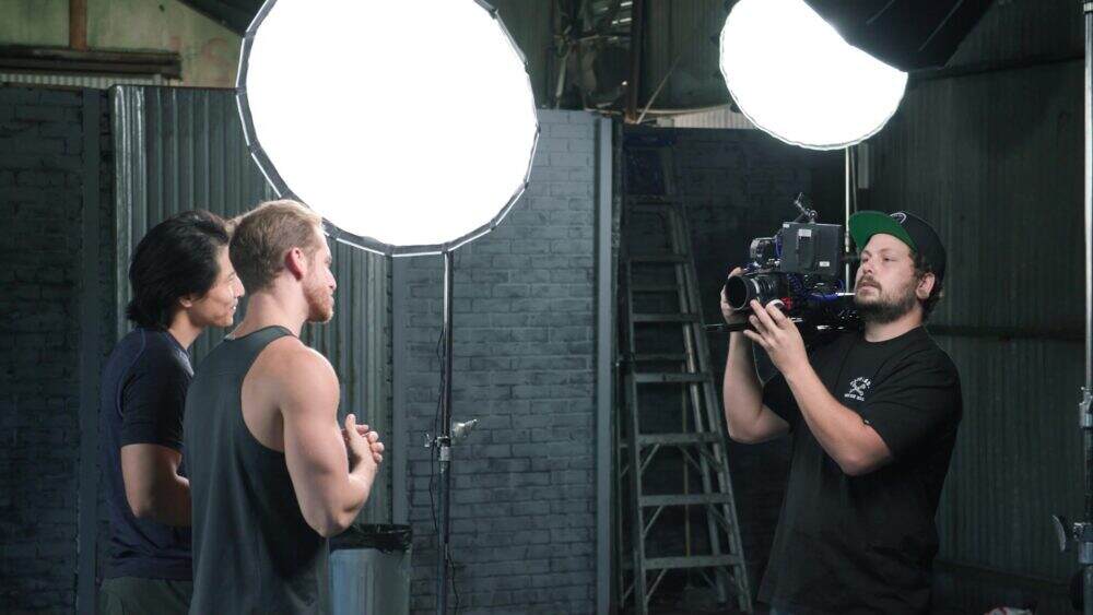 Two models in a studio utilising Aputure softboxes.