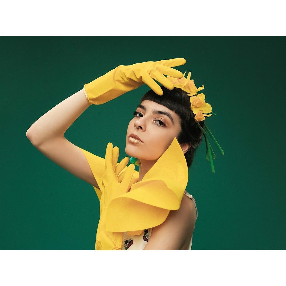 Image of a female model utilising the Colorama Seamless Studio Background Paper.