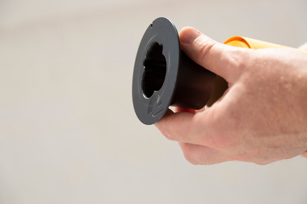 Colorama Paper Brake being attached to a roll of Background Paper.