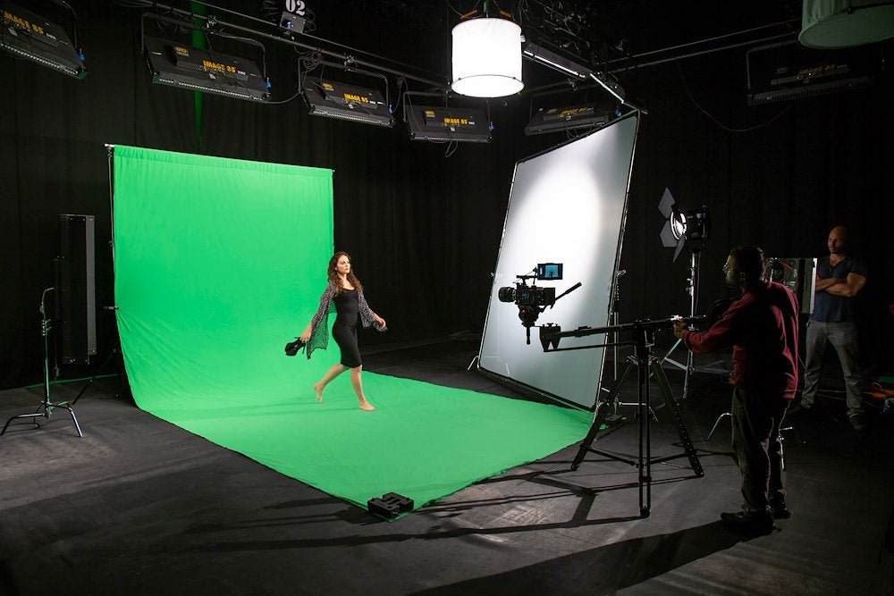 Lastolite Chromakey Green Curtain 3x7m Background in a studio setup with various lighting fixtures.