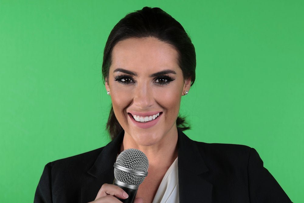 Female being photographed with the raw green screen behind.