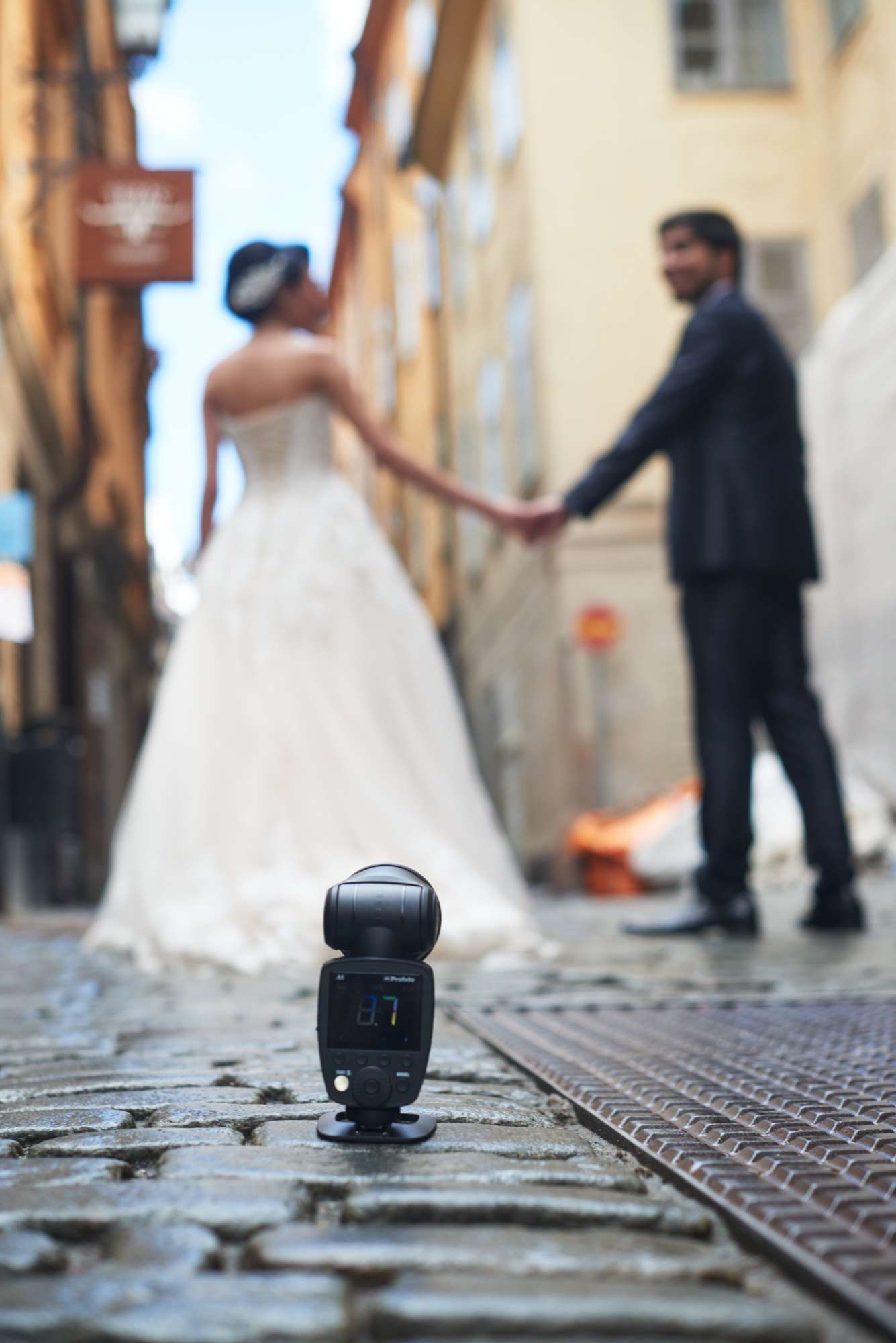 Profoto A series flash stand holding an A1 photographing a wedding couple.