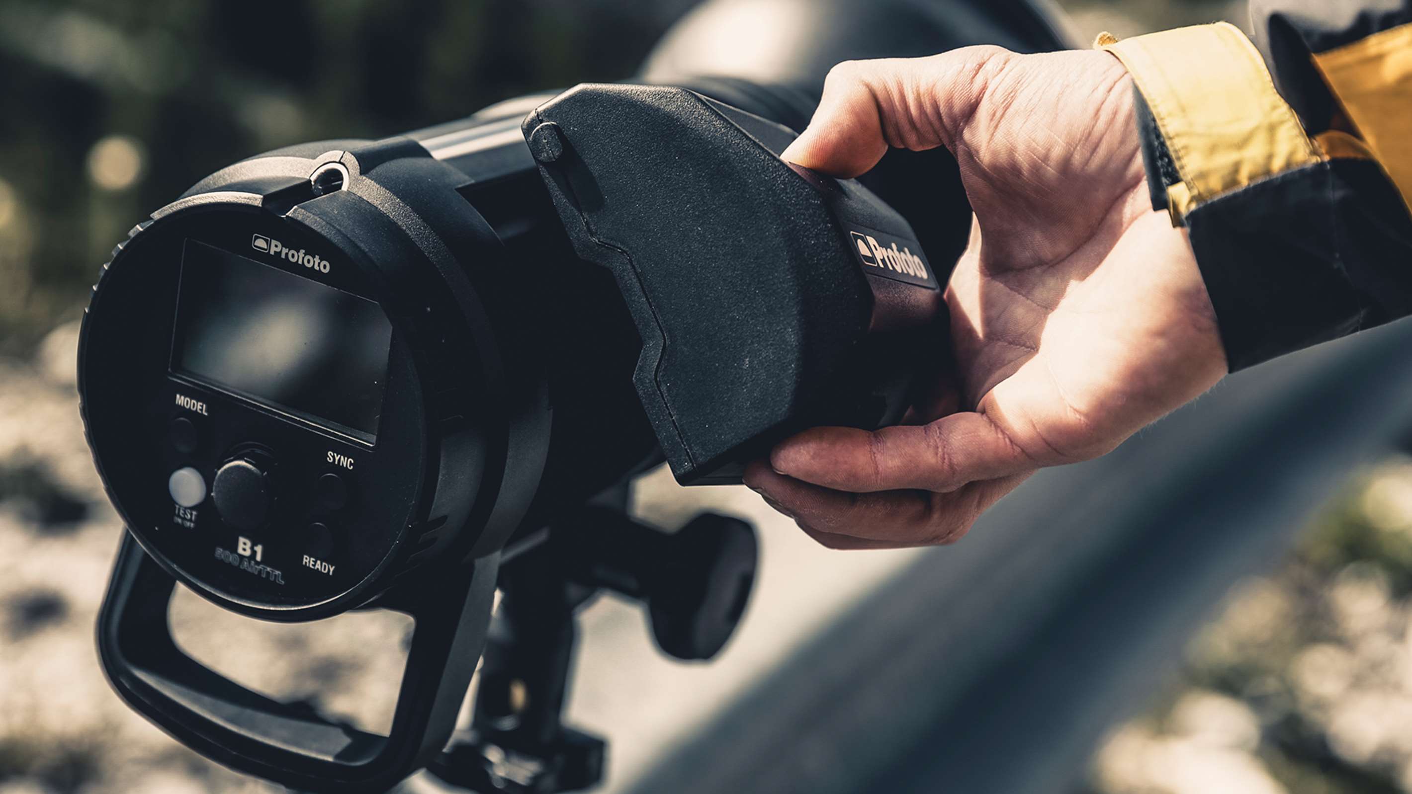 Profoto B1X & B1 Li-Ion Battery MkII being inserted into a Profoto B1.