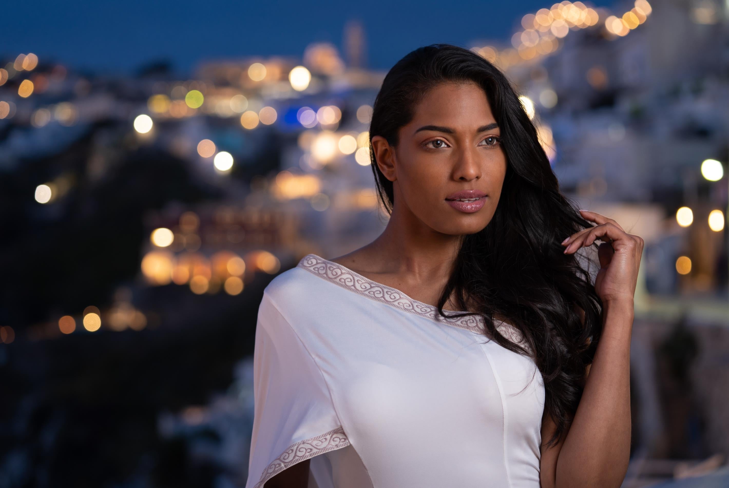 A Female model being photographed with a Profoto OCF Beauty Dish being utilised.