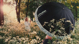 Umbrella with a diffuser being used on a location shoot
