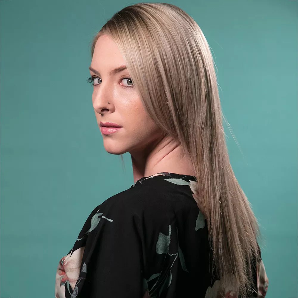 Portrait of a female model utilising Savage 1.3m Baby Blue background paper.