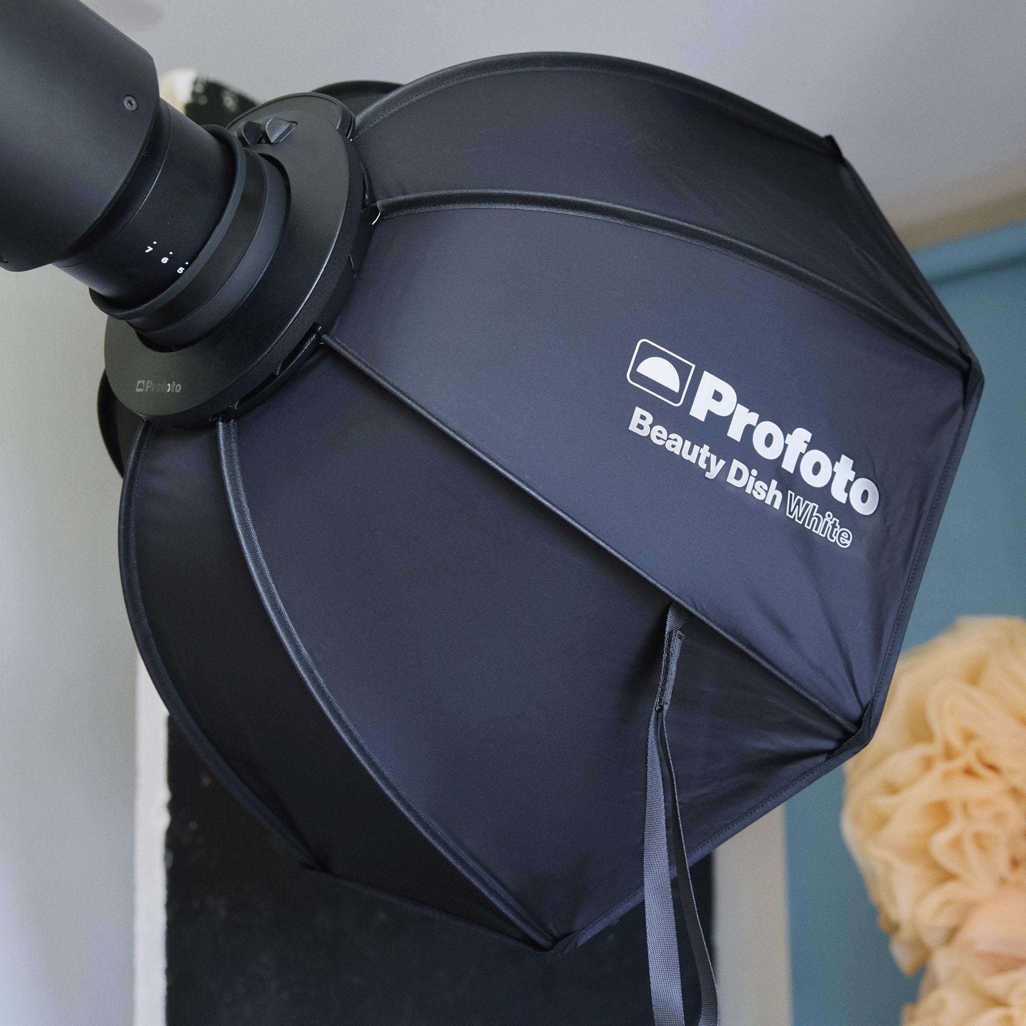 Profoto Beauty Dish White studio light modifier on flash head. 