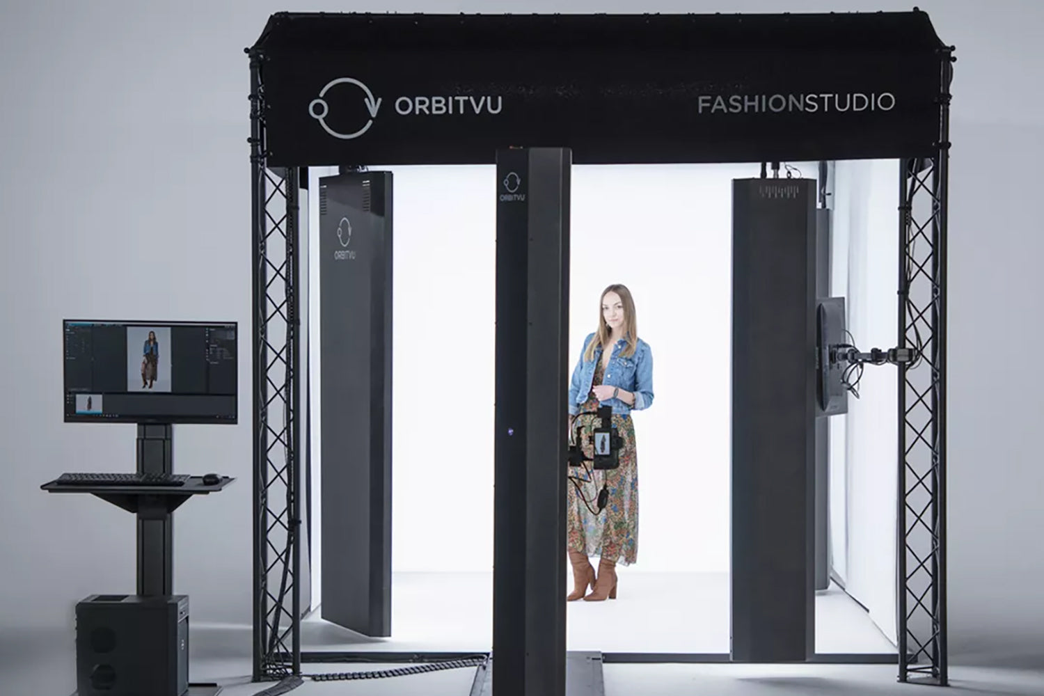 The Orbitvu Fashion Studio in use with a model and PC in the foreground. 