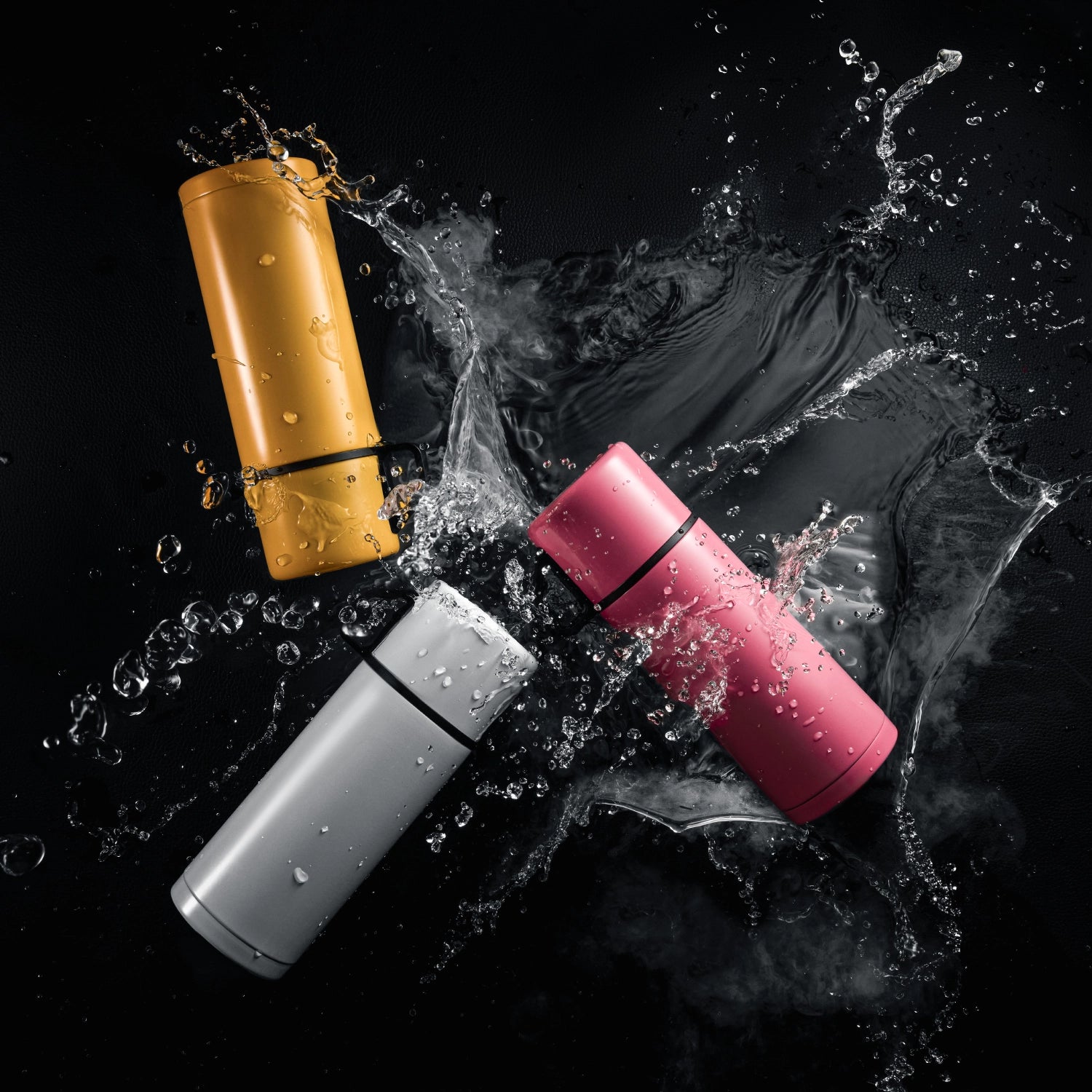 Coloured cosmetics containers with a splash of water. Image shot using the Profoto Pro-D3.