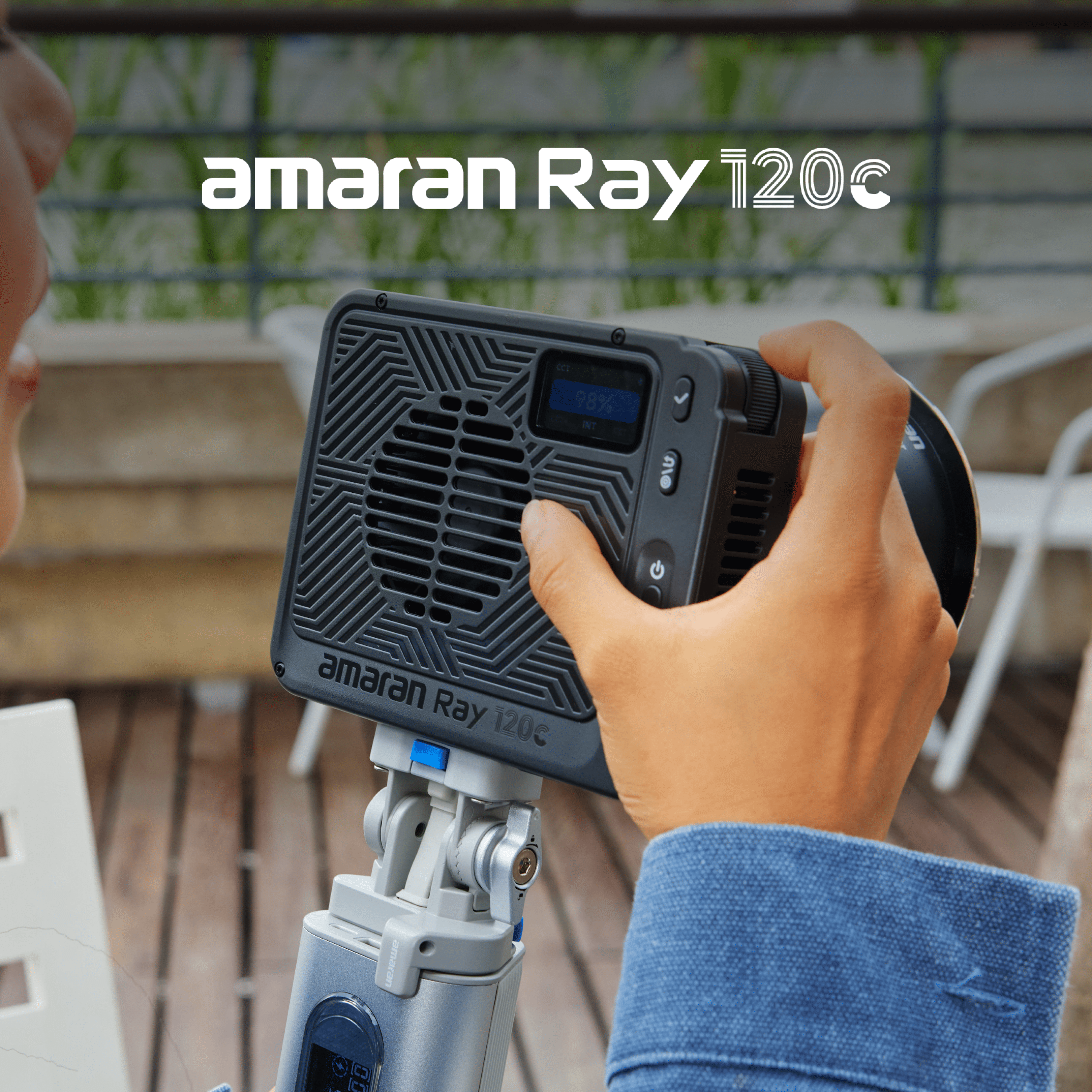 A person controlling an amaran Ray 120c on a set.