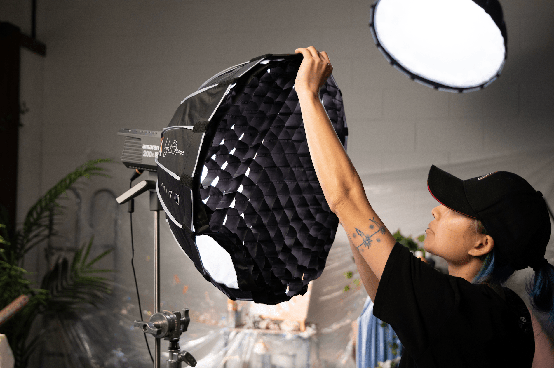 Lighting Operator attaching Fabric grid to Light Dome Mini III.