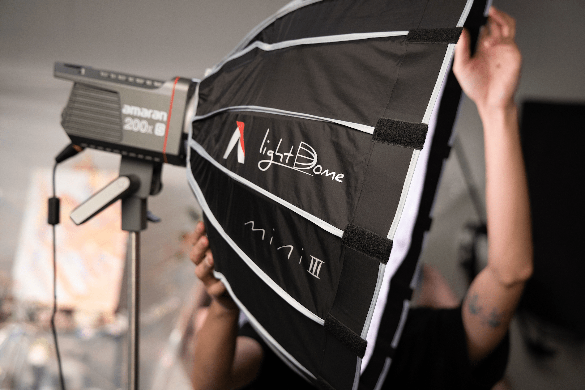 Close-Up side view of Aputure Light Dome Mini III attached to an amaran 200x.